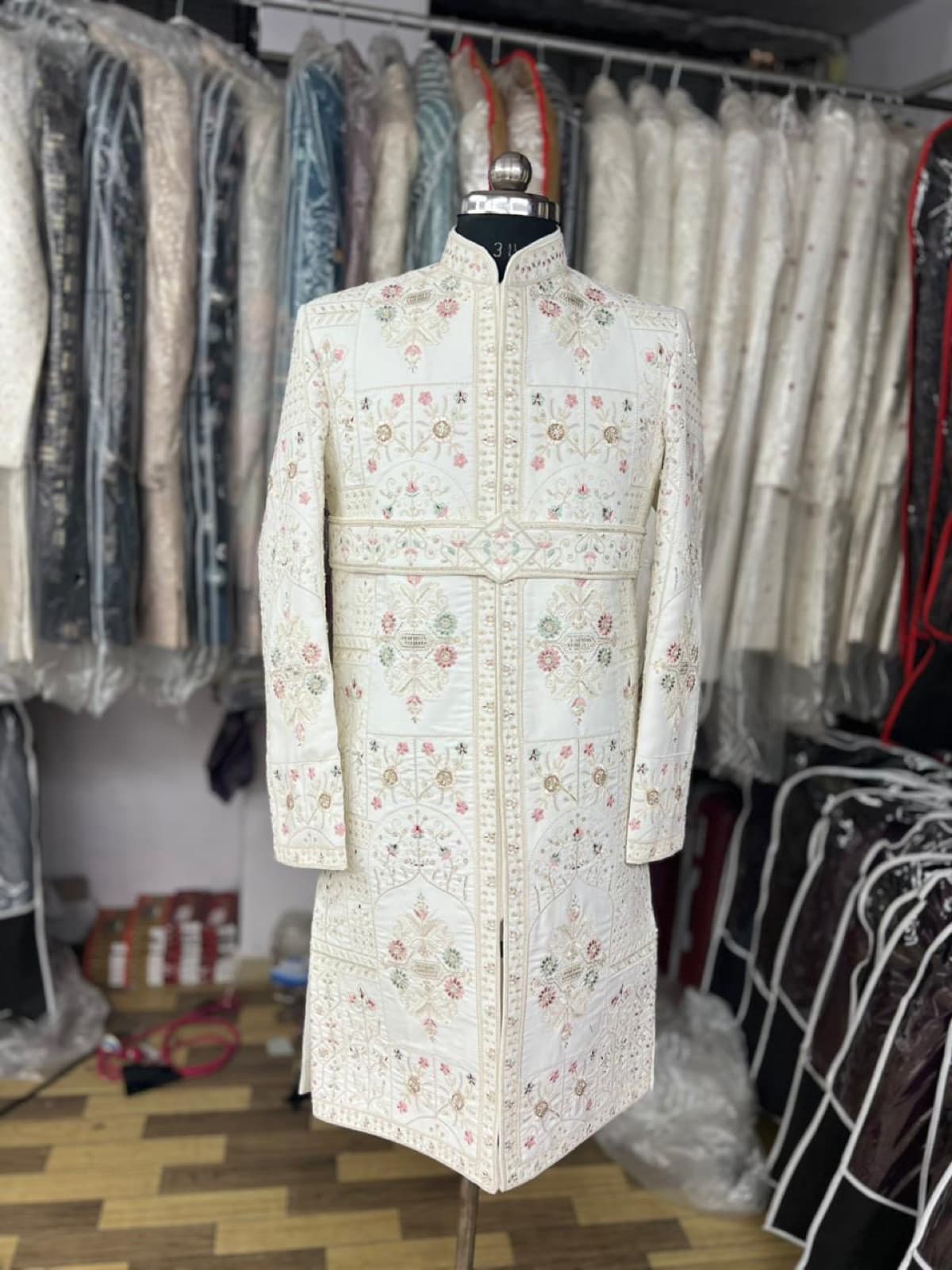 Ivory sherwani with pastel resham work